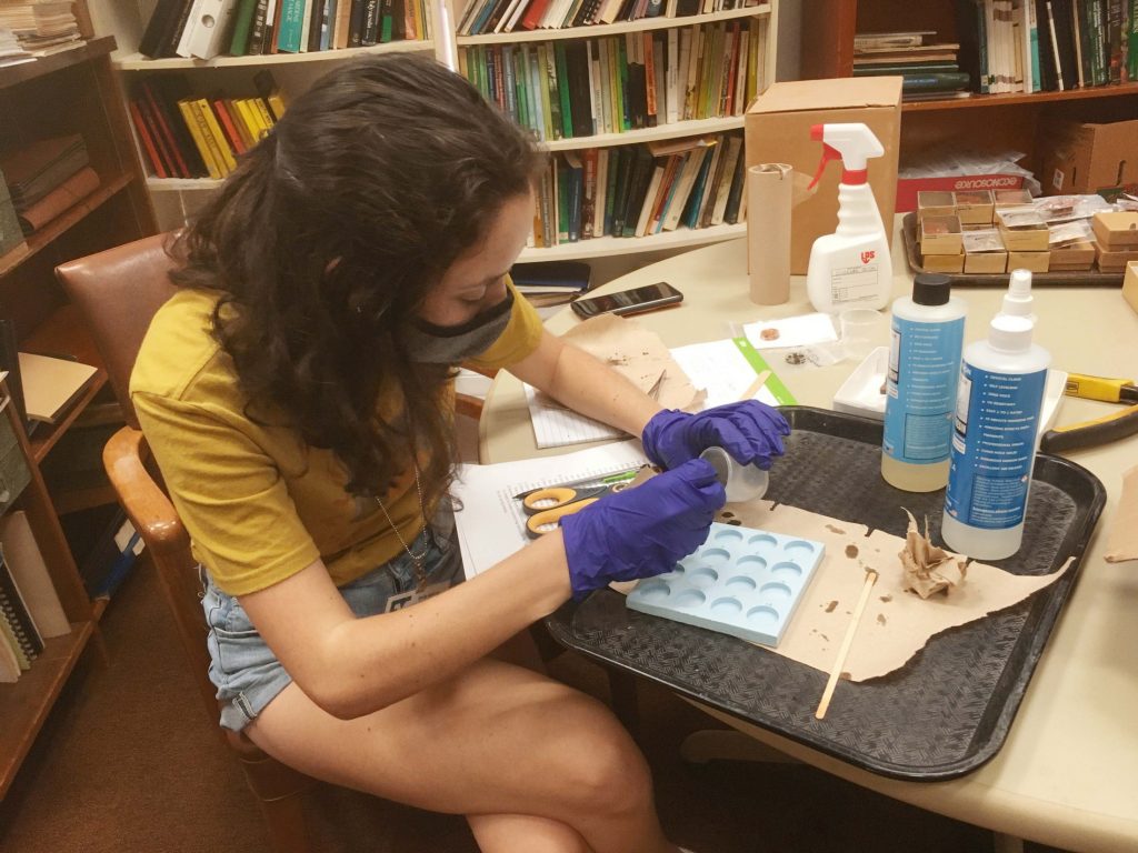 Emily Kracht embeds pottery fragment sinto resin for analysis