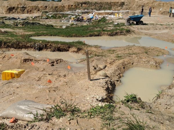 dig site with many deep puddles